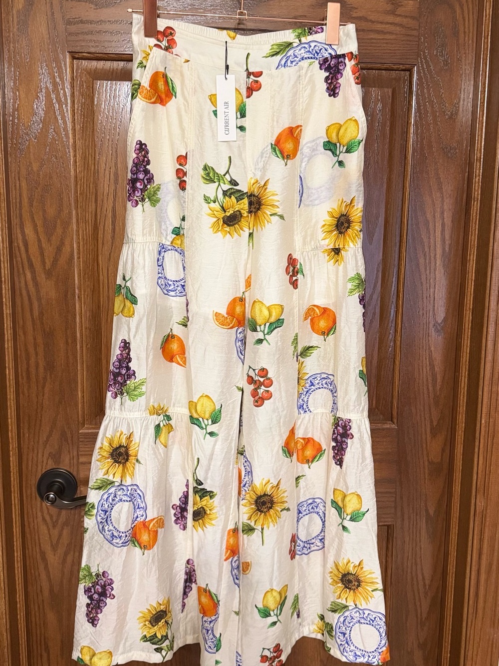 NWT Current Air Size XS tiered wide-leg pants feature fruit and sunflower print.